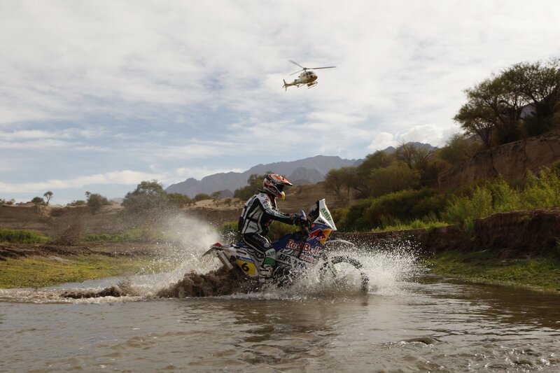 Motorcycle rider crossing river