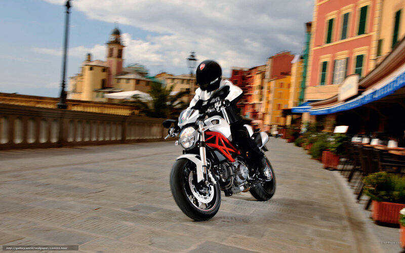 Motorcycle rider in a European town