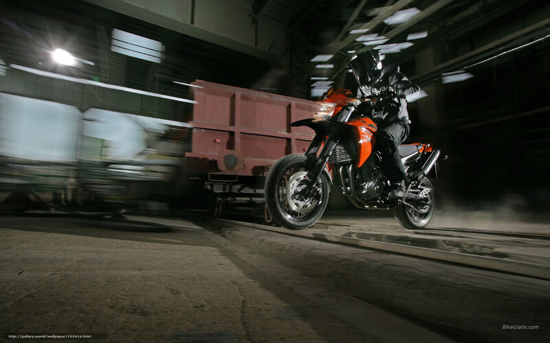 Motorcycle rider in industrial setting