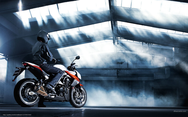 Motorcycle rider in industrial setting