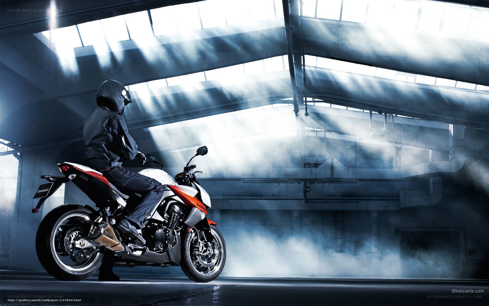 Motorcycle rider in industrial setting
