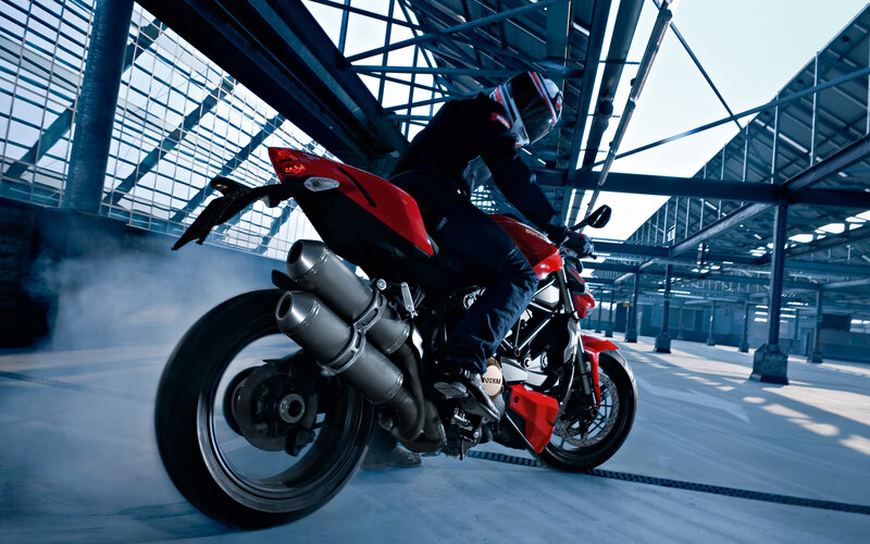 Motorcycle rider in industrial space
