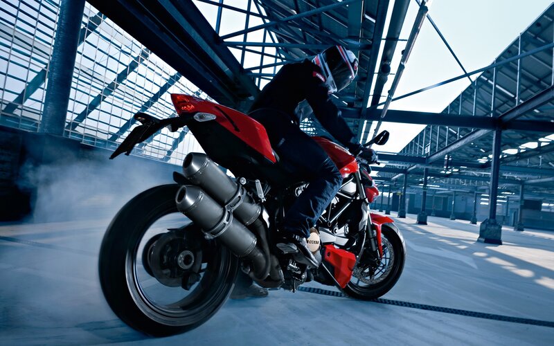 Motorcycle rider in industrial space