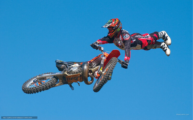 Motorcycle Rider in Mid-air — Blue, Dynamic, Afternoon, Photograph, Helmet