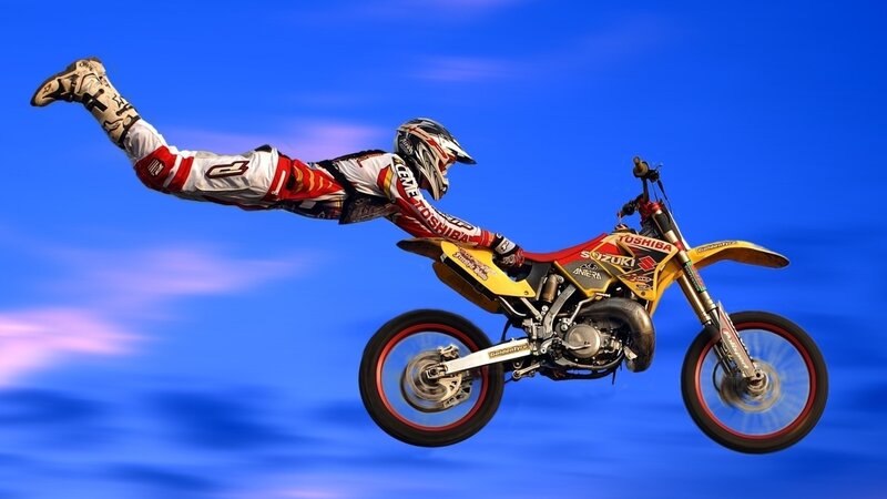 Motorcycle Rider in Mid-air — Blue, Dynamic, Photograph, Helmet, Sky
