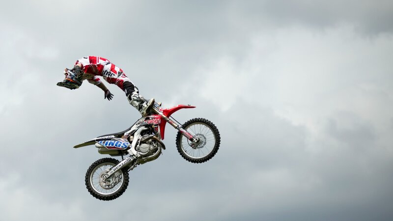 Motorcycle Rider in Mid-air — Gray, Dramatic