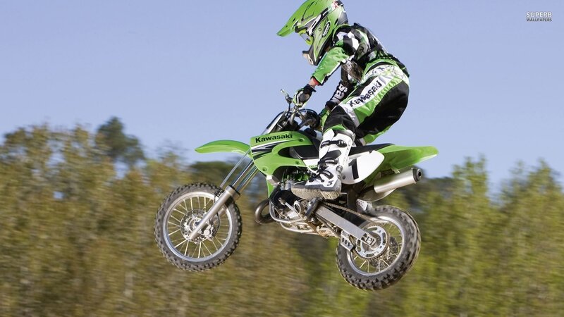 Motorcycle Rider in Mid-air — Green, Dynamic, Afternoon, Photograph
