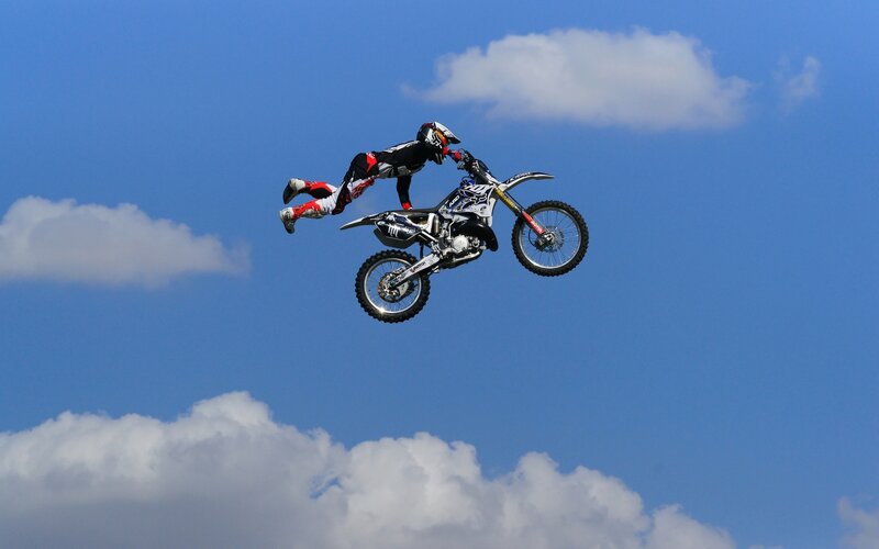 Motorcycle rider in mid-air jump