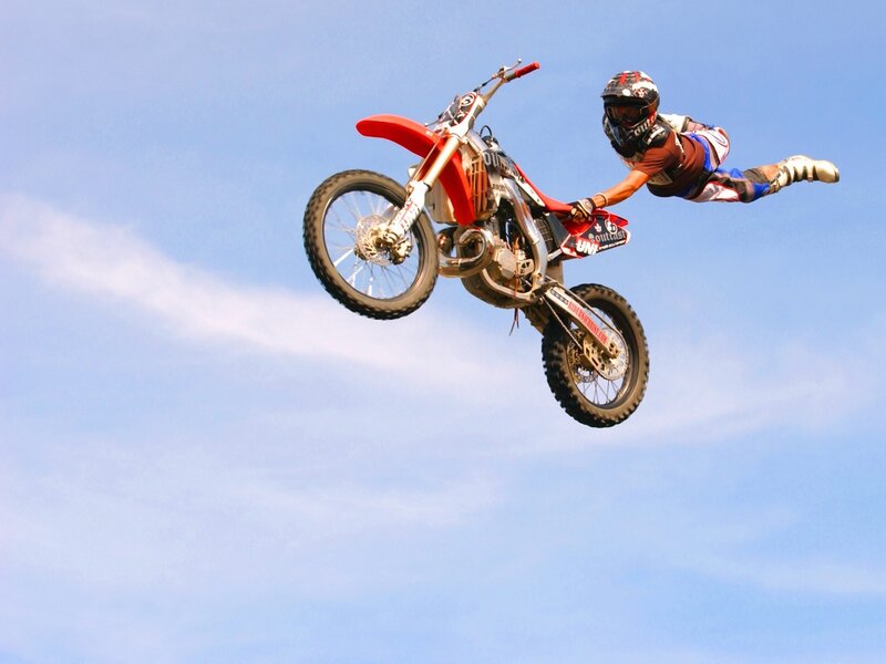Motorcycle rider in mid-air jump