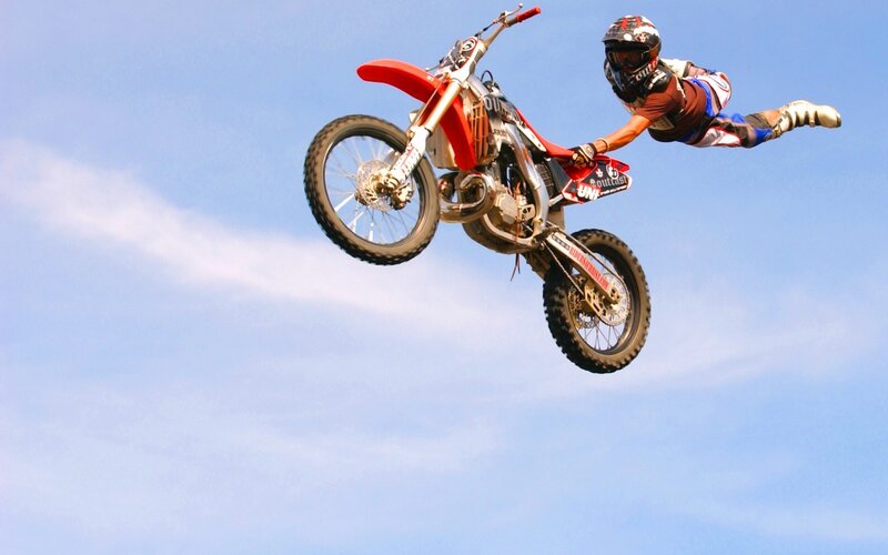 motorcycle rider in mid-air jump