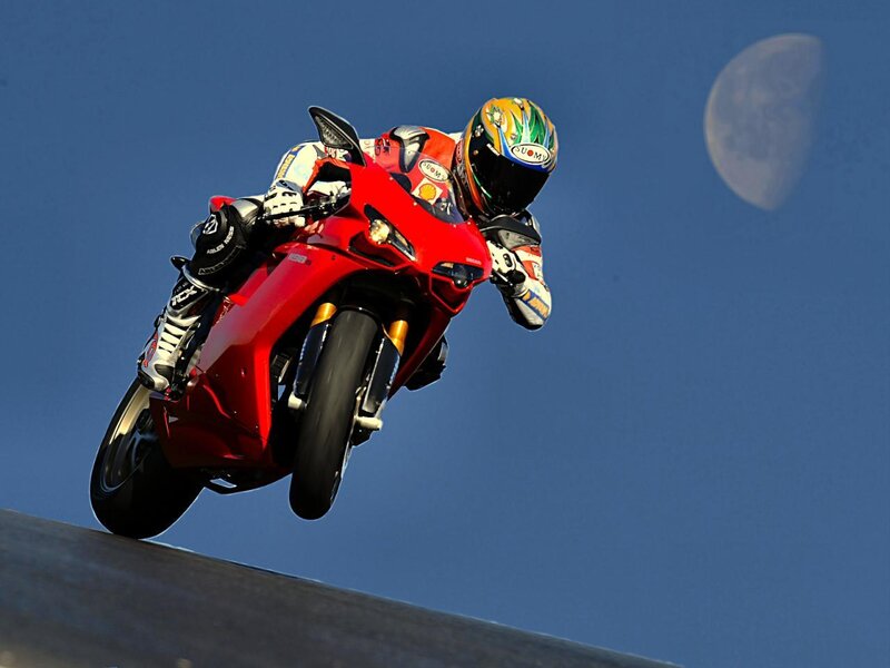 Motorcycle rider in mid-air jump