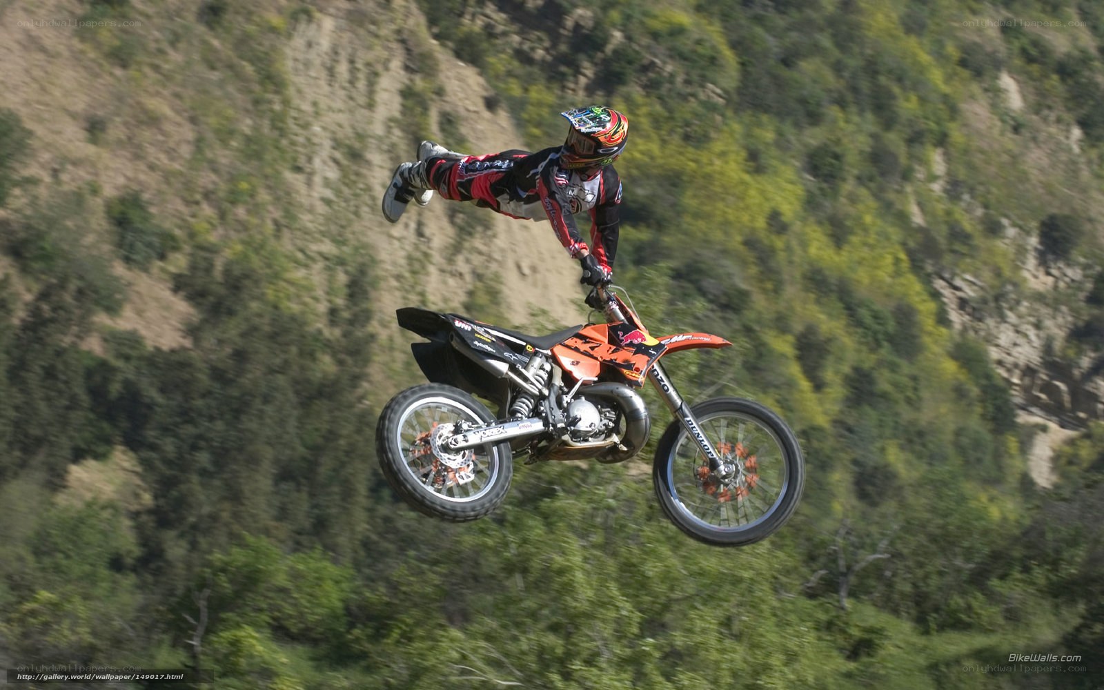 Motorcycle rider in mid-air jump