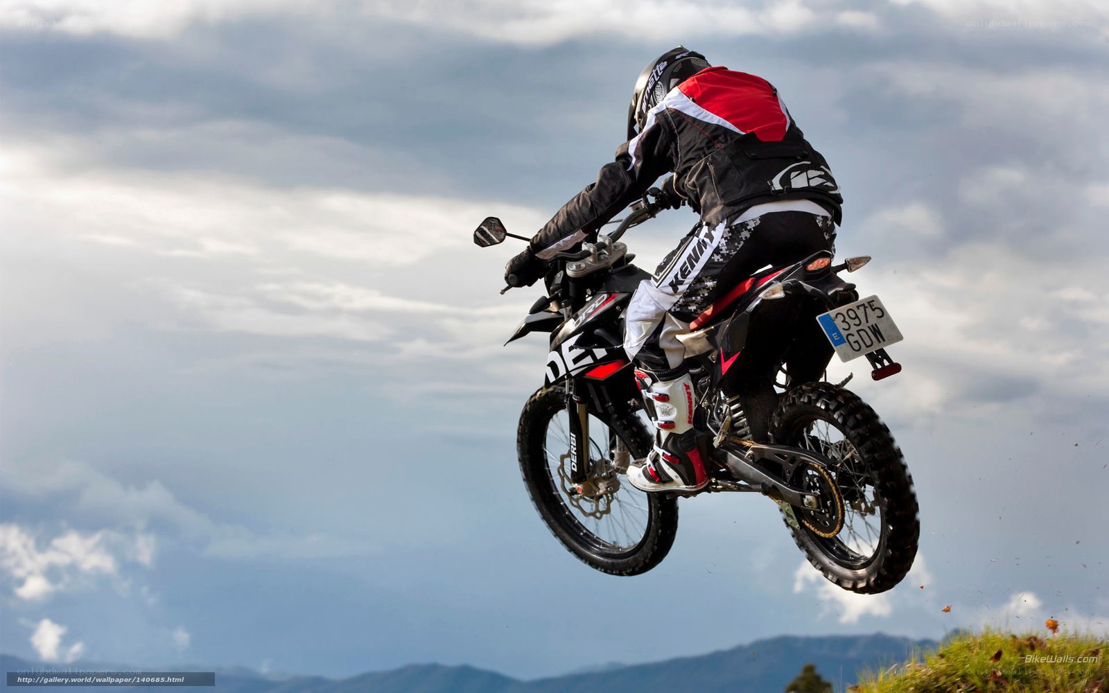 Motorcycle rider in mid-air jump