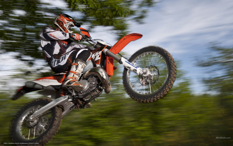 Motorcycle Rider in Mid-air — Orange, Dynamic, Afternoon, Photograph, Helmet