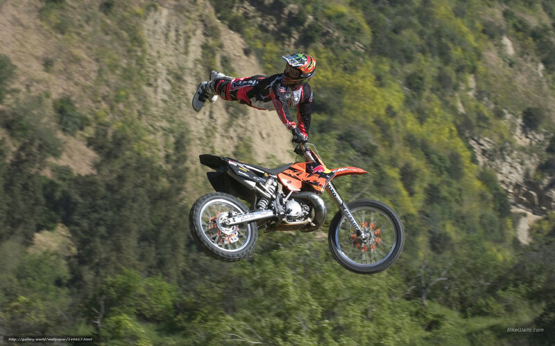 Motorcycle Rider in Mid-air — Orange, Dynamic, Afternoon