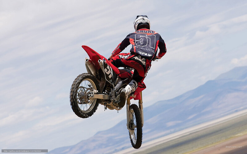 Motorcycle Rider in Mid-air — Red, Dynamic, Afternoon, Photograph, Mountains