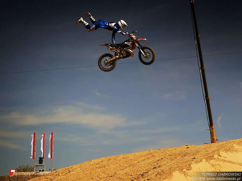 Motorcycle rider in mid-air stunt