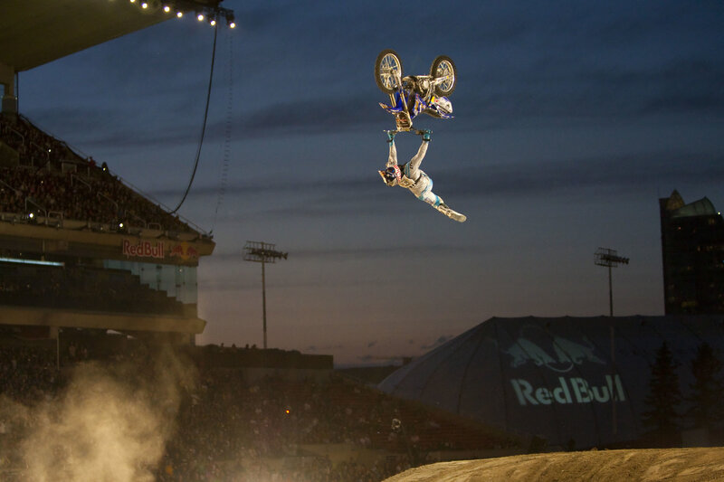 Motorcycle rider in mid-air stunt