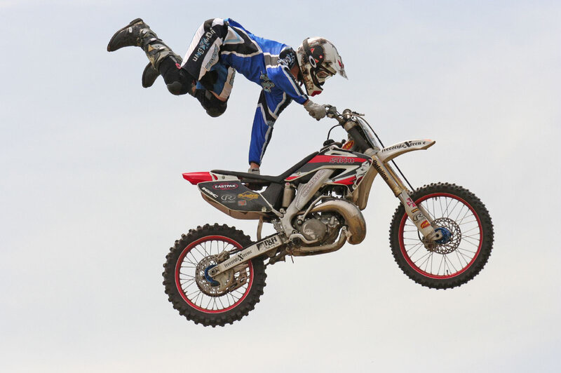 motorcycle rider in mid-air stunt