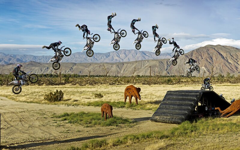 Motorcycle rider in mid-air stunts