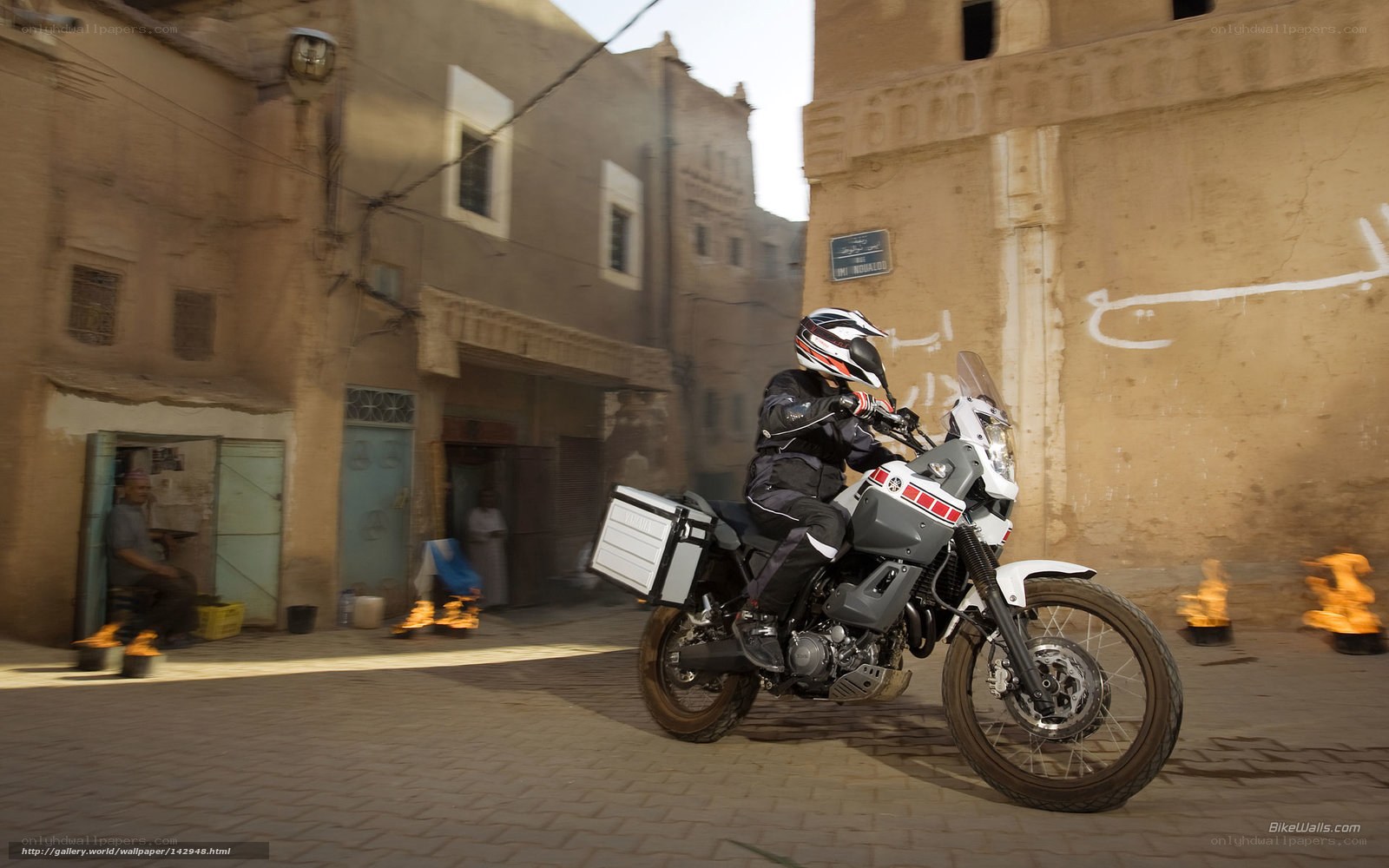 motorcycle rider in narrow street