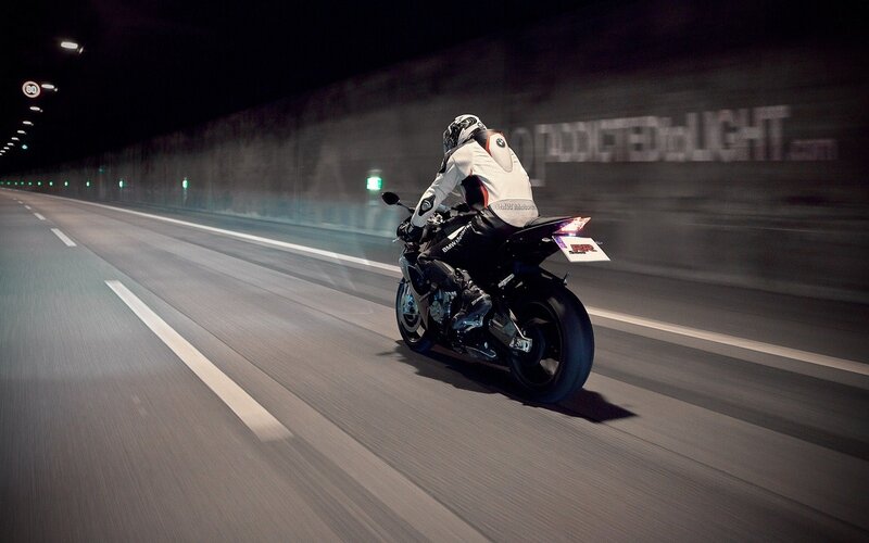 Motorcycle rider in tunnel
