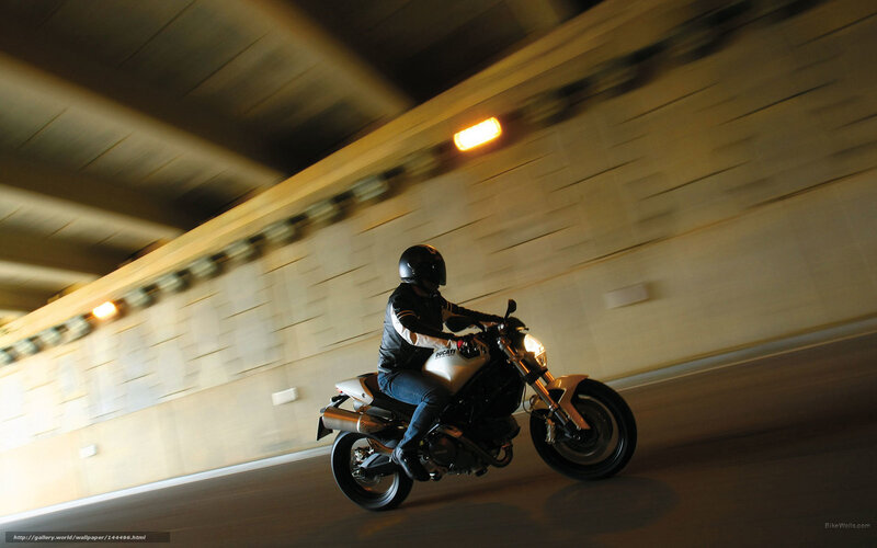 Motorcycle rider in tunnel