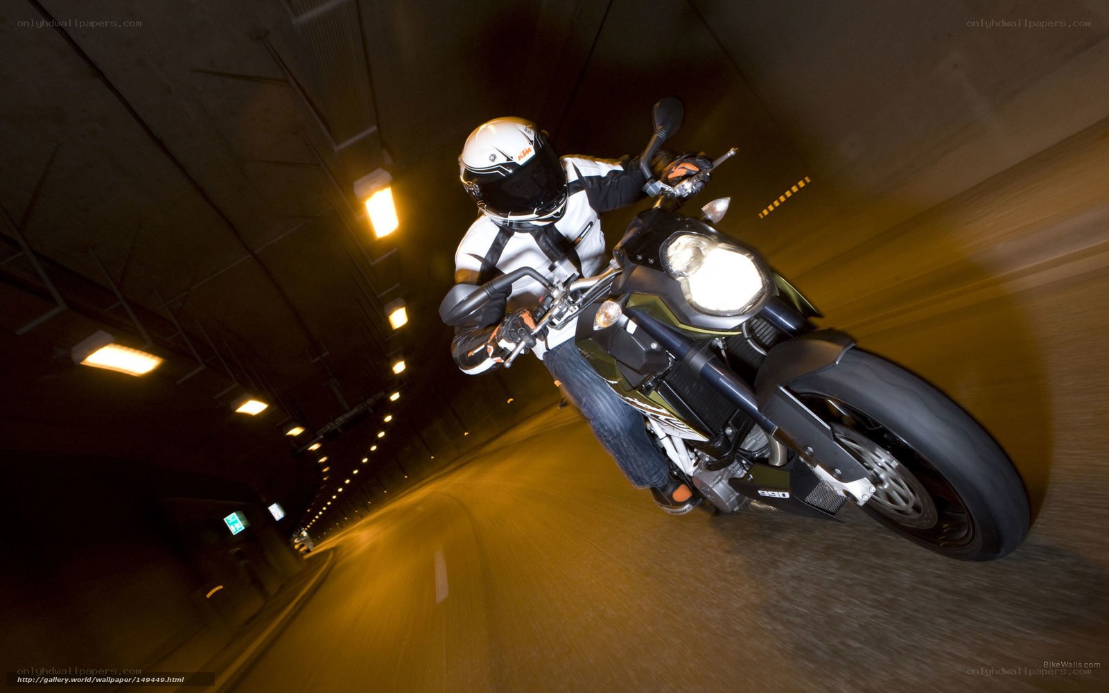Motorcycle rider in tunnel