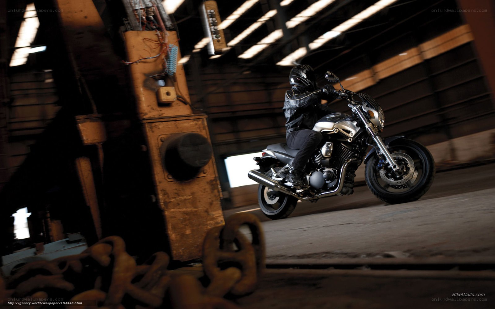 Motorcycle rider in warehouse