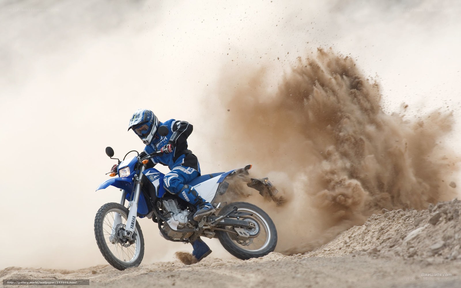 Motorcycle rider kicking up dust