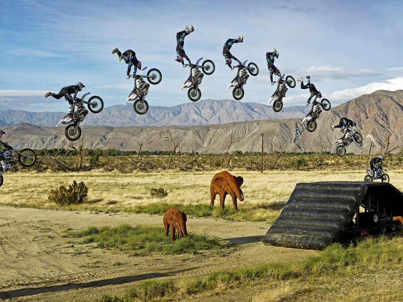 Motorcycle Rider Mid-air — Blue, Dramatic, Afternoon