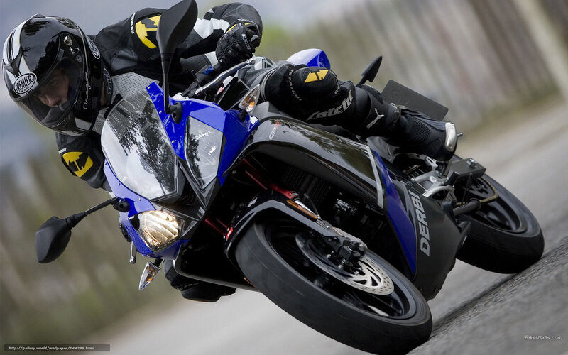 Motorcycle rider on a blue sportbike