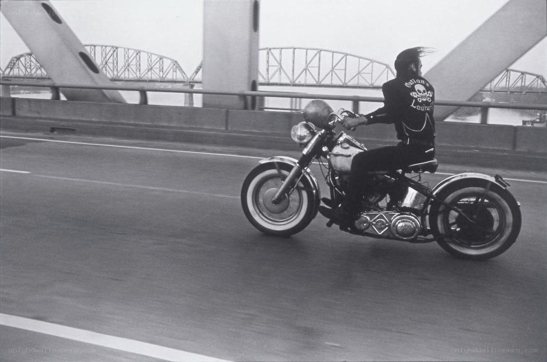 Motorcycle rider on a bridge