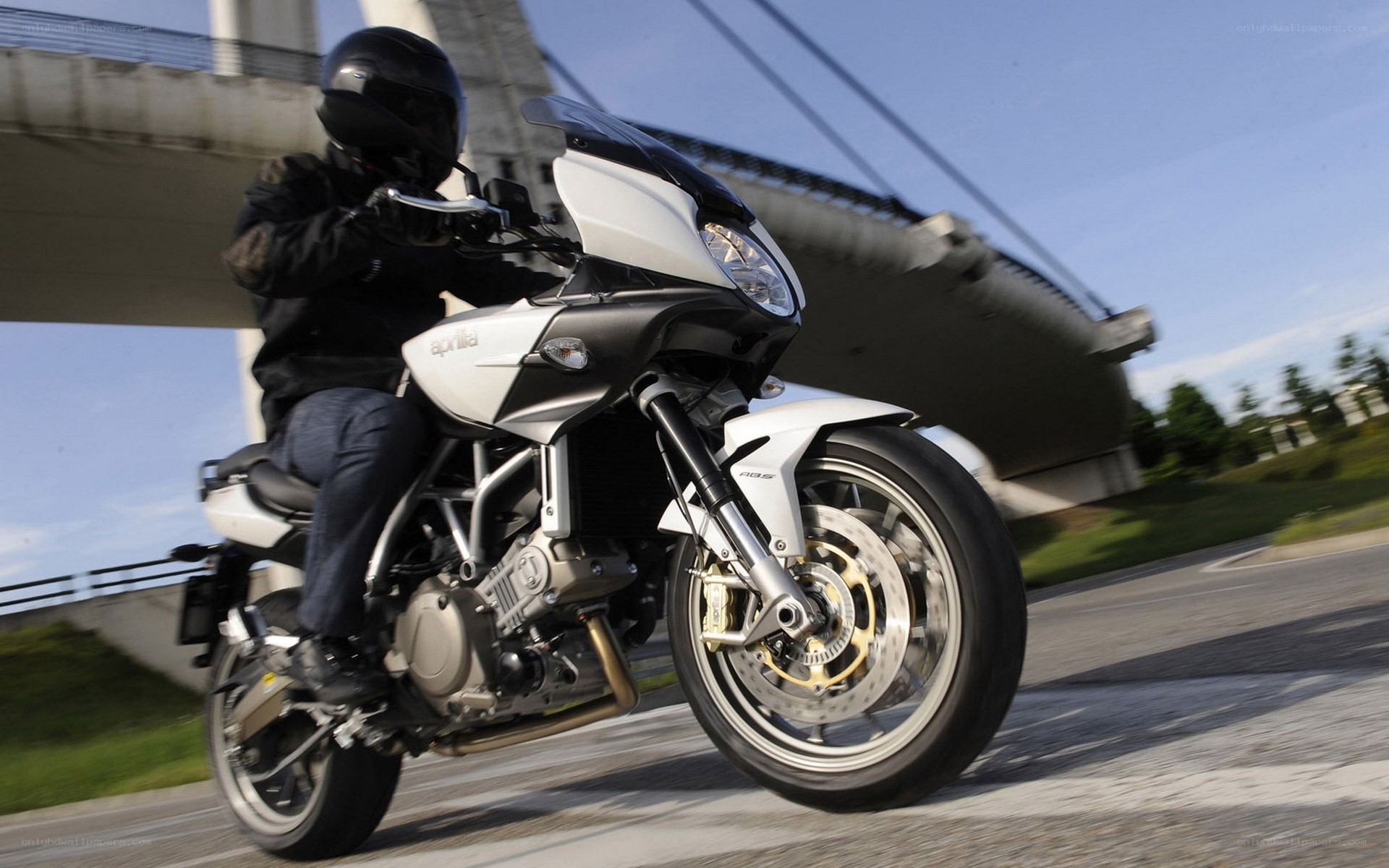 Motorcycle rider on a bridge