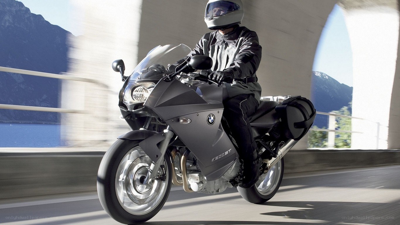 motorcycle rider on a bridge