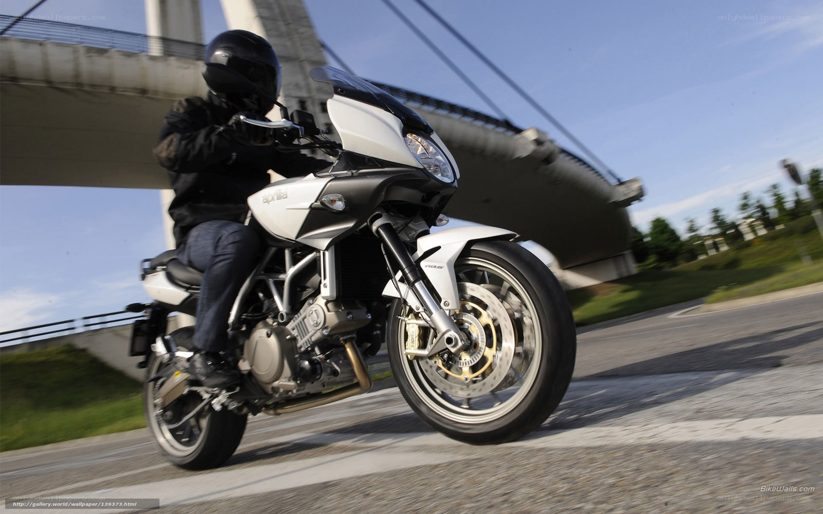 motorcycle rider on a bridge