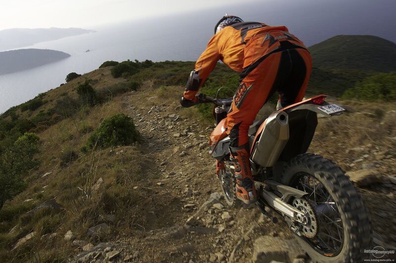 Motorcycle rider on a coastal trail