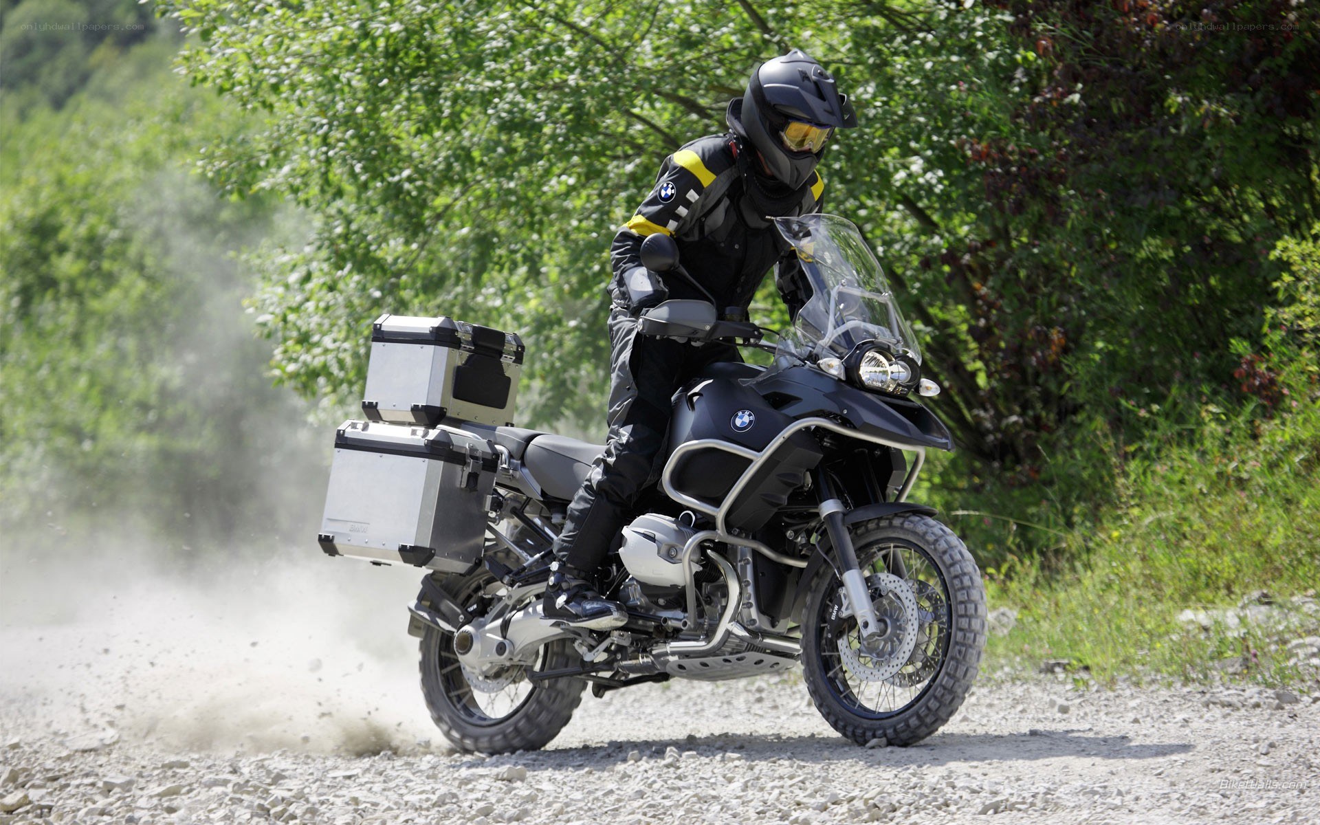 Motorcycle rider on a dirt path