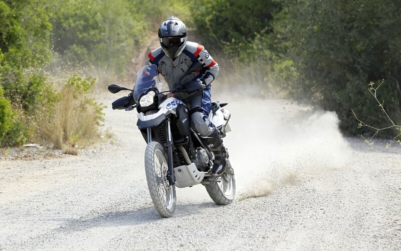 Motorcycle rider on a dirt road