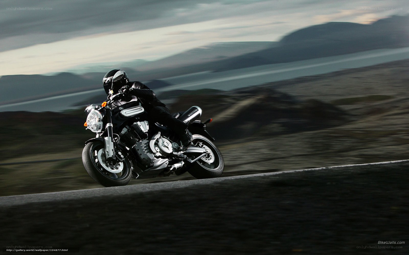 motorcycle rider on a scenic road