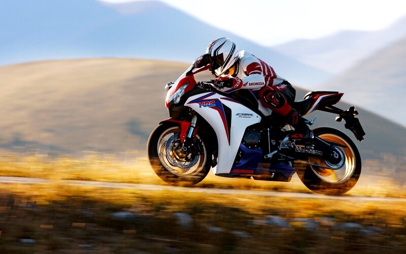 Motorcycle rider on a scenic road