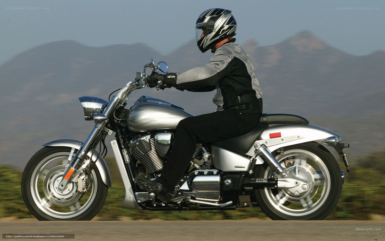 Motorcycle rider on a scenic road