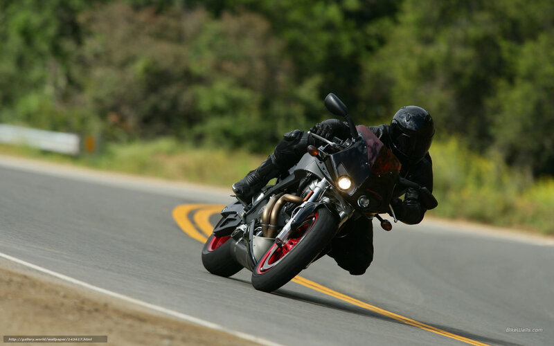 motorcycle rider on a winding road