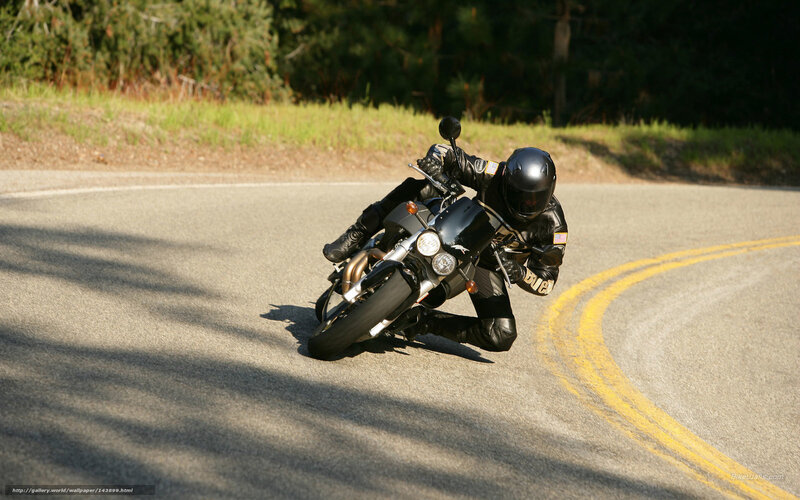 Motorcycle rider on a winding road