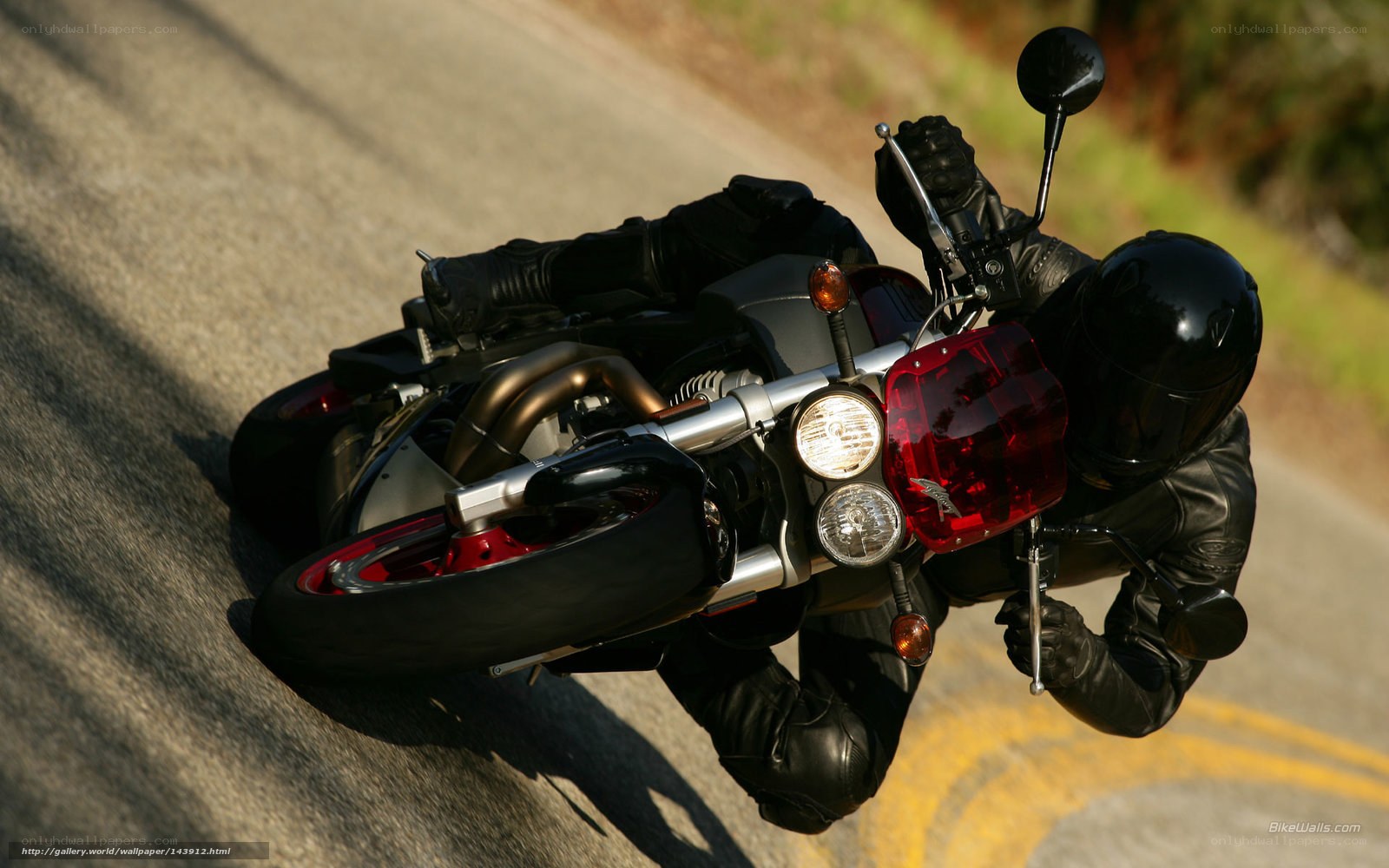 Motorcycle rider on a winding road