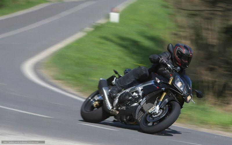 motorcycle rider on a winding road