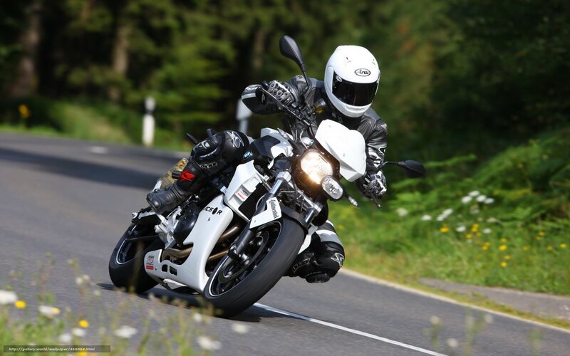 Motorcycle rider on a winding road