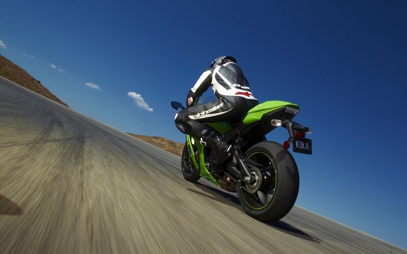 motorcycle rider on a winding road