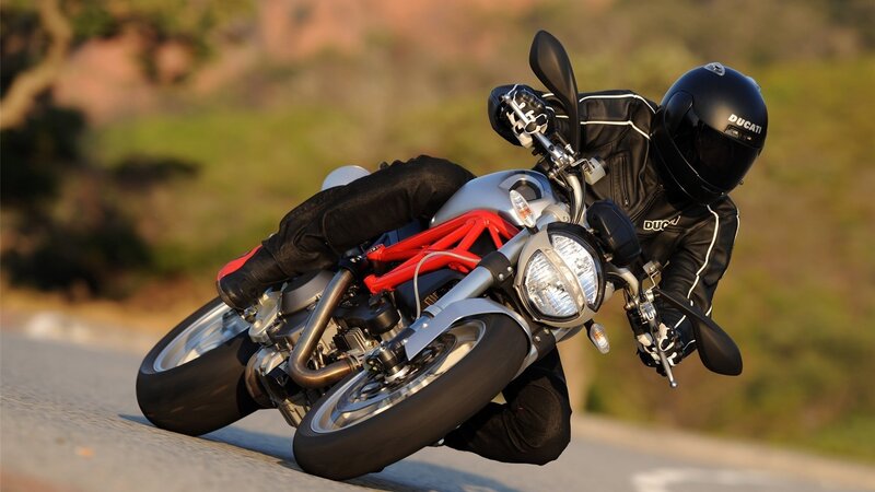 Motorcycle rider on a winding road