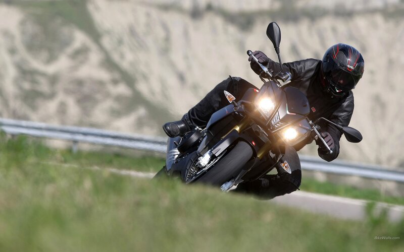 Motorcycle rider on a winding road
